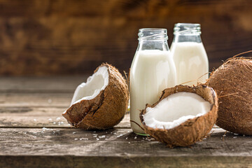 Vegan non dairy healthy or fermented drink. Coconut kefir in glass bottle on wooden table. healthy drink, food concept