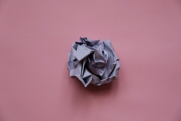 a ball of crumpled colored paper in the form of a rose