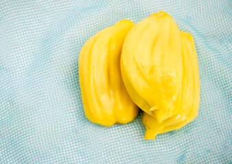 two pieces Jackfruit close up isolated on a colorful background