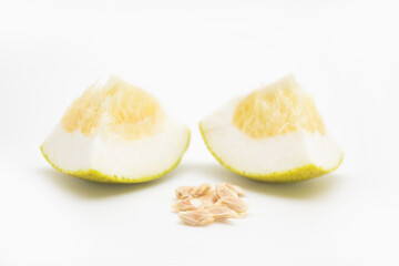ripe pomelos and pomelos seeds slice on white background