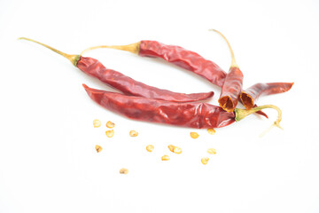 three red chilli peppers isolated on white