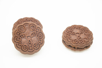 chocolate color biscuit over on white background, selective focus