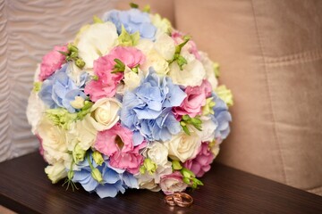 Wedding bouquet with wedding rings. Selective focusing and shallow depth of field