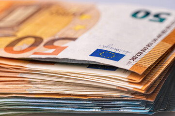 fifty and twenty euro banknotes close-up. Cash background