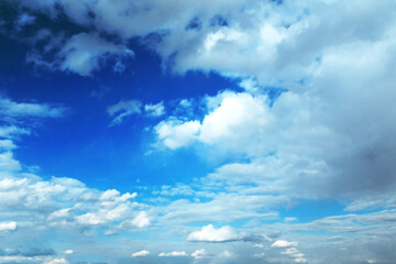 Rows of white clouds in spring and a bright blue sky