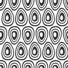 Abstract seamless vector pattern with hand drawn stylized eggs, rounded shapes. Vector black and white background.
