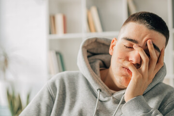 portrait of young teenager with bored or overwhelmed expression