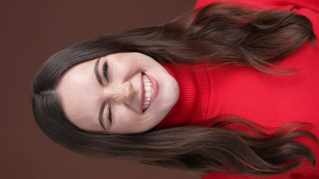 Positive lady make different faces isolated brown color background