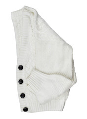Folded white knitted cardigan with black buttons isolated on white. Flat lay
