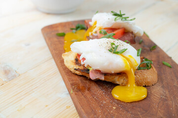 Sandwich with ham and Poached Egg. Wholemeal Bread Toast smoked ham and egg ,  healthy breakfast or snack.