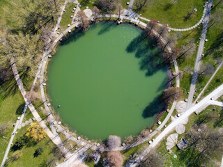 Aerial view of artificial lake inside urban park.