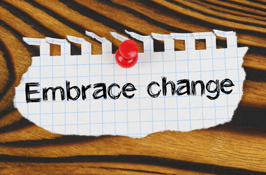 Attached to the board is an announcement with the inscription - Embrace change