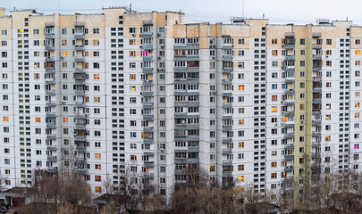 Fototapeta na wymiar Windows of multi-storey panel residential buildings in a residential area of a large city.