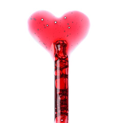 Cosmetic liquid dropper with red serum in pipette and in heart love shape with bubbles isolated on...