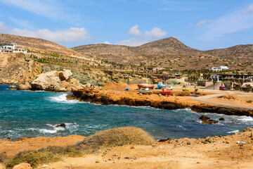 Fototapeta na wymiar Koumbara beach located in a rocky bay on Ios Island. Cyclades, Greece