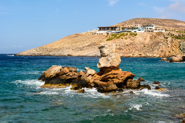 Rocky coast of Koumbara beach located on Ios Island. Cyclades, Greece