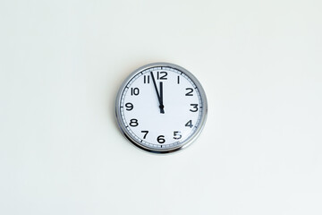 Clock at 12 o'clock on white background