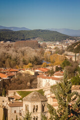 Girona and mountains view from the old wall on a sunny day.