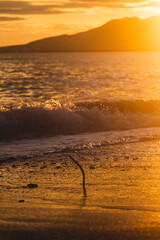 Metal piece on the beach in Malaga, Spain, at the sunset.