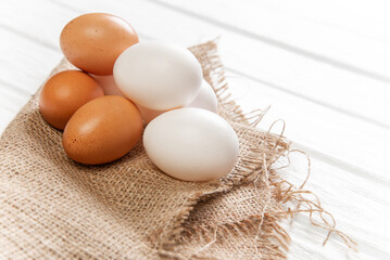 The eggs are brown and white. farm eggs