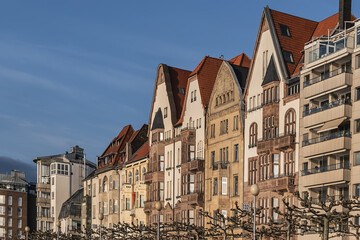 Beautiful traditional medieval buildings along the picturesque river Rhine promenade at sunset. DUSSELDORF, GERMANY.