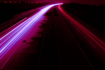 Night road lights. Lights of moving cars at night. long exposure red, blue, green