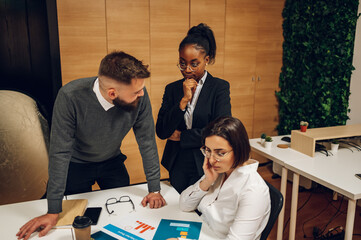 Stressed business team having a meeting in the office and solving a problem