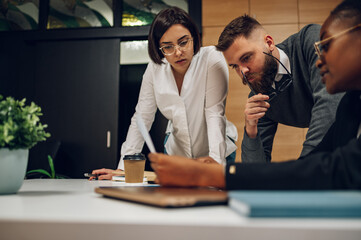 Multicultural team working together in office and having a meeting