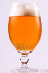 Glass of cold and light beer isolated on white background