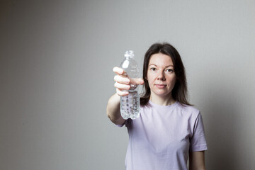 woman holding a bottle of water.