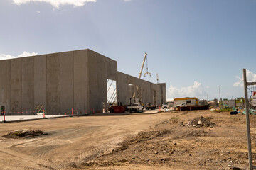 Construction site for a warehouse being built using tilt-up prefabricated concrete panels on...