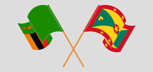 Crossed and waving flags of Zambia and Grenada