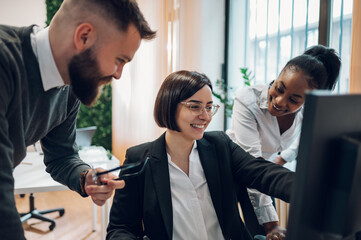 Multicultural team working together in office and having a meeting