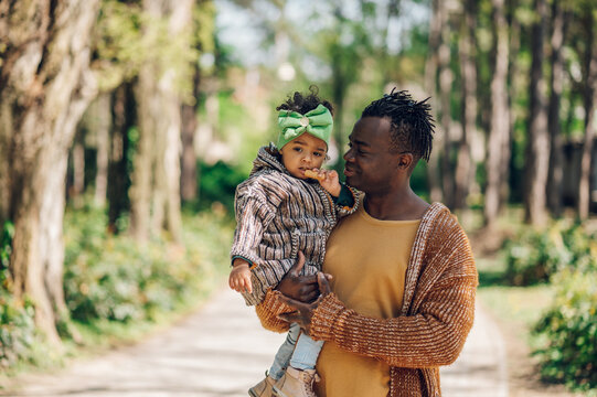 African american father spending time with his daughter in the park