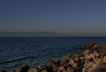 sunset, blue sea and rocks