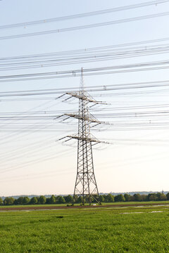 Green Electricity, Green Energy, Eco Energy, Eco Electricity, Transmission Tower Overhead Line Masts, A Lot Of High-voltage Power Line, High Voltage Pylons Also Known As Power Pylons On The Fields