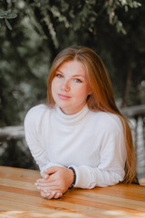 Obraz premium spanking a girl with freckles on her face and long red hair
