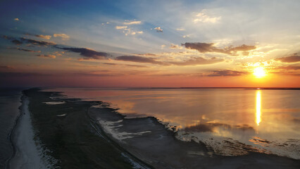 Sunset on spit between the sea and the estuary in the national park "Tuzlovsky Limany", Odessa region, Ukraine