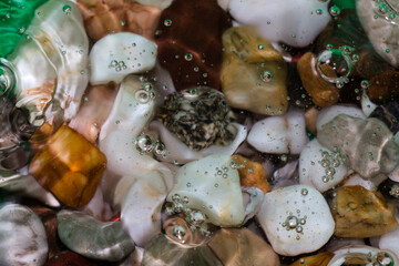 colorful stones in the water summer concept