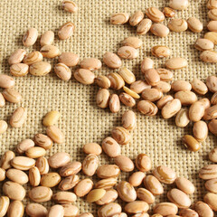Carioca beans. Pinto beans on the jute fabric.