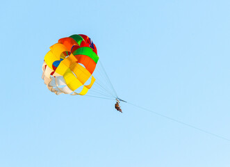 parasailing boat towing the parachuters, extremal beach amusement