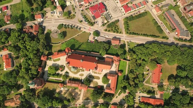 Aerial 4K video from drone to of old town of Frombork on a beautiful summer day. 
There is a wonderful view of Frombork Castle,Baltic Sea and the churches. Frombork
,Poland, Europe. (Series)
