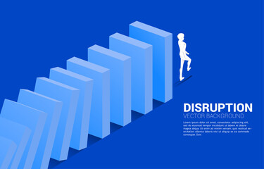 Silhouette of businessman walking from the end of domino collapse. Concept of business industry disrupt