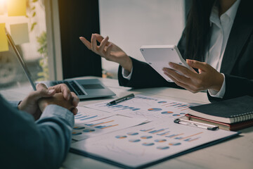 Business Consulting meetings to work and brainstorm new business projects and discuss financial data and graph reports. teamwork meeting concept