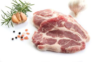 Sliced raw pork meat with herbs on white background. Top view