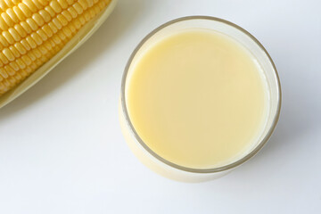 Sweet corn juice ,fresh corn milk and corn on the table. Healthy drink
