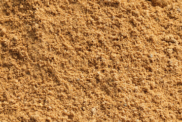 Fototapeta na wymiar Closeup of sand for construction. piles of sand on a construction site.