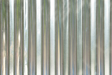 Closeup of metal stainless steel strips, zinc wall, pattern texture. zinc industrial texture background.