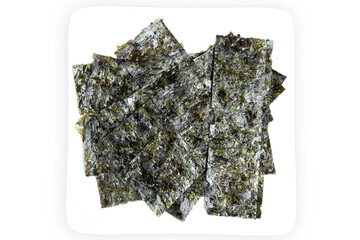 Japanese food nori dry seaweed sheets, crispy seaweed on a white plate.Top view