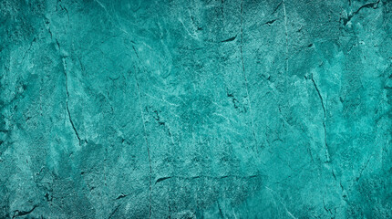 Blue green abstract background. Toned rough rock surface texture. Beautiful teal background with...